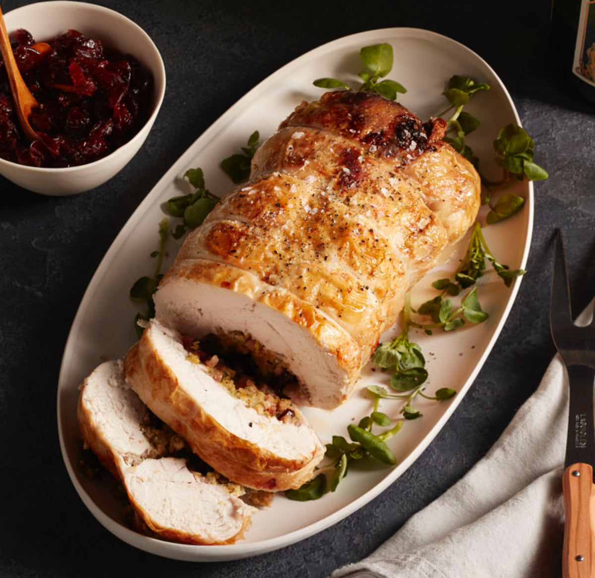 FESTIVE ROLLED CHICKEN WITH CRANBERRY AND PISTACHIO STUFFING